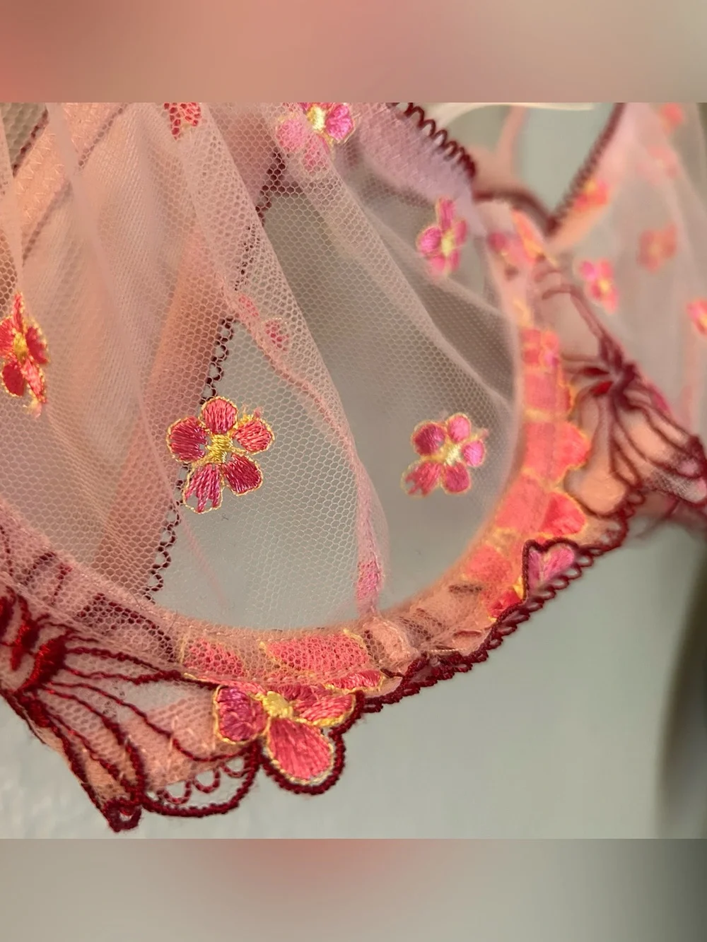 Out from under pink floral embroidered  underwire bra